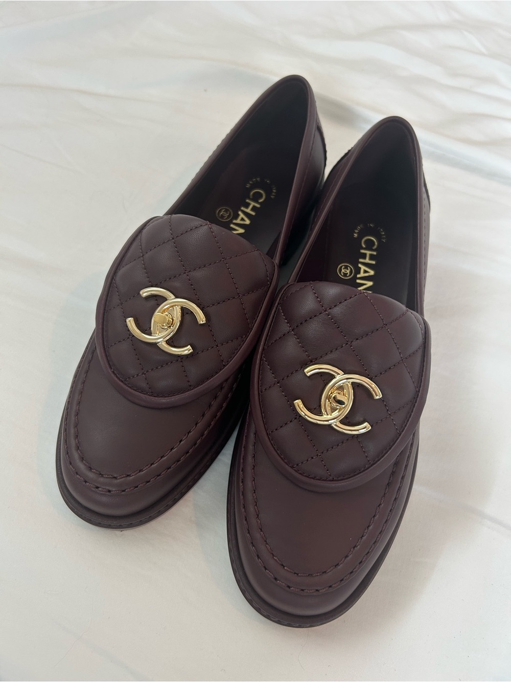 Chanel 2025 turnlock quilted loafers in burgundy 37